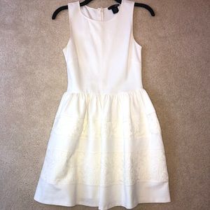 Bloomingdales white dress with flower detail.